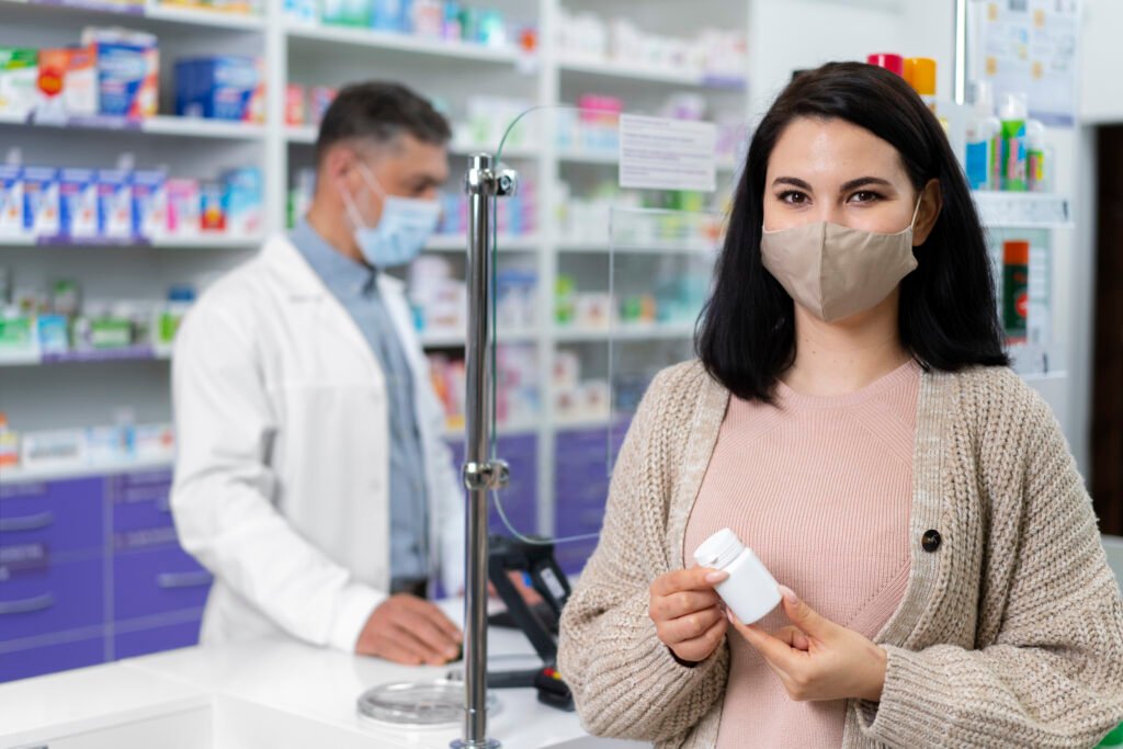 medium shot pharmacist helping patient (1)
